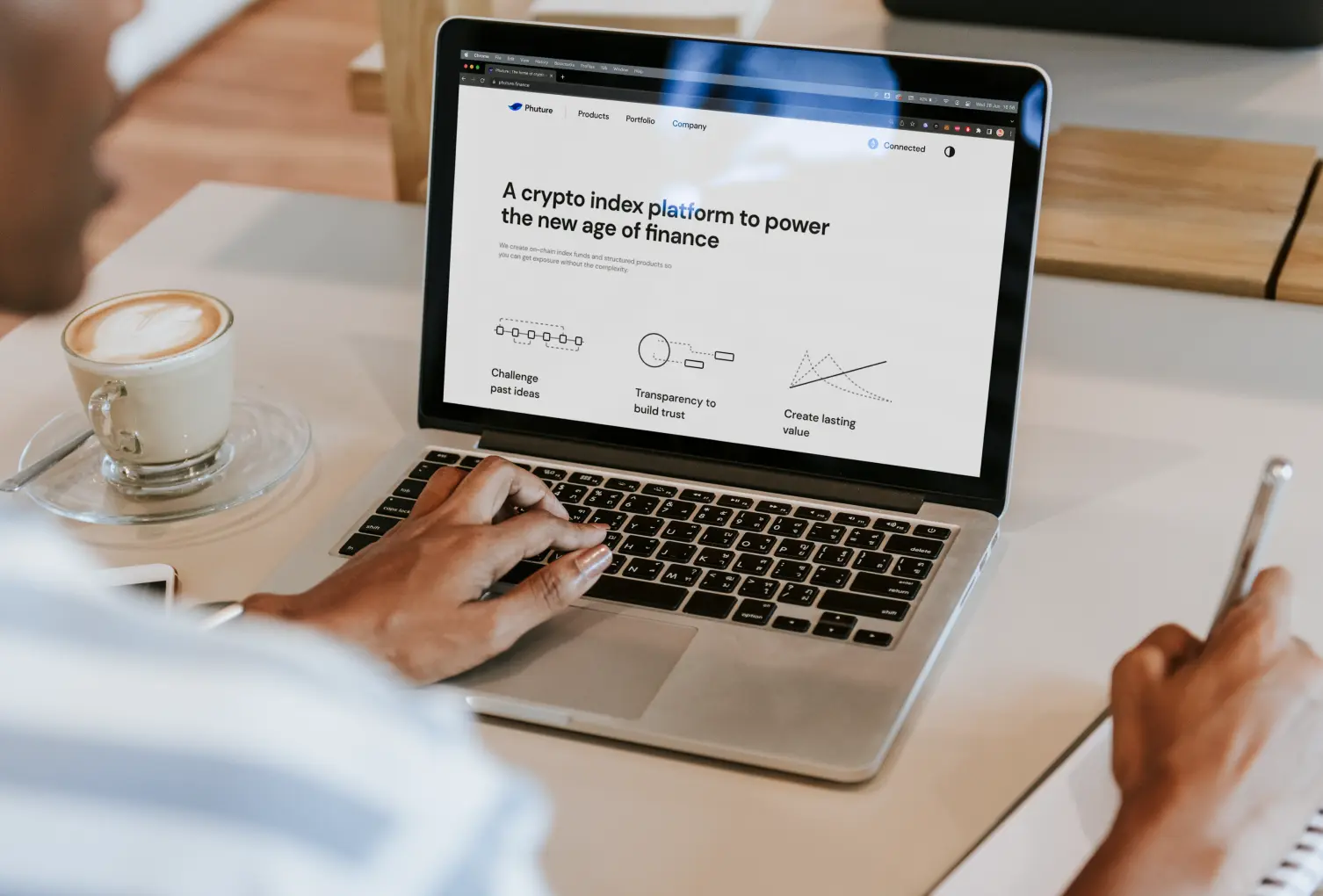 The Phuture site open on a laptop, showing the company page and its three principles